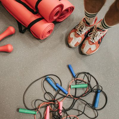 Close-up of athletic shoes on a training mat.